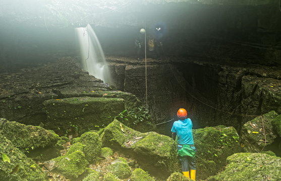 Ecuador Mayei Cave Entrance With Speleologist