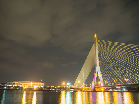 Rama VIII Bridge at night on the river in thailand © roongrote