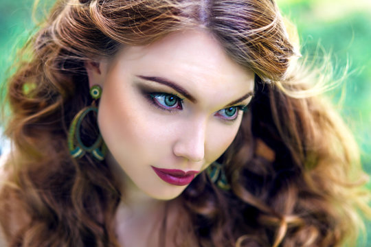 Young, red-haired, beautiful girl with green eyes, makeup
