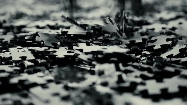 puzzle parts falling on white table