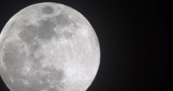 A real time shot of the full moon on a clear night. Moon is real and not computer generated. 10-bit 4:2:2 file available.  	