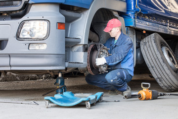 Mechanic repair truck is on the Jack