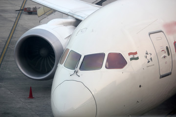 Front view of an airplane parked in airport