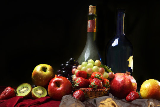 Classic Dutch still life with two bottles of wine and wet fruits on a dark background, horizontal
