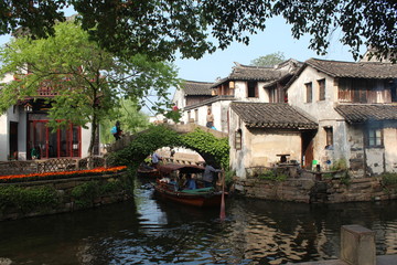 Fototapeta na wymiar China Chinese Water Town Watertown Jiangsu Zhouzhuang Traditional Tradition Boat Boats Bridge Bridges Home Homes Houses House Blue Sky Green Tree Trees Scene Corner Asia Asian