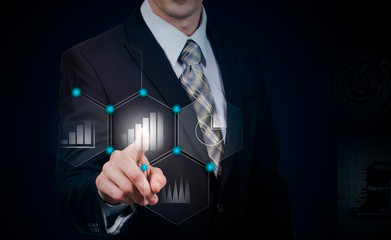 business, cyberspace and future technology concept - close up of businessman in suit working with virtual charts over dark backg