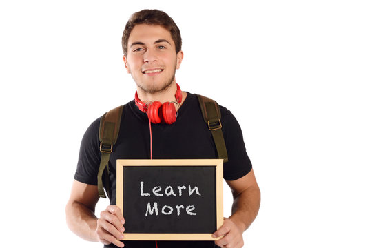 Man holding chalkboard with "learn more".