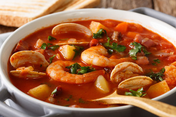 American cuisine: Manhattan clam chowder soup macro. horizontal