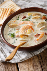 New England clam chowder soup close-up. vertical