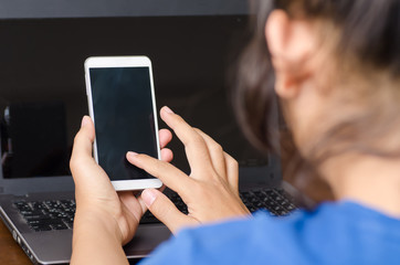 Man using smart phone and laptop for business working