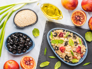 Vegan salad with quinoa, red orange and black olives