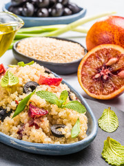 Vegan salad with quinoa, red orange and black olives
