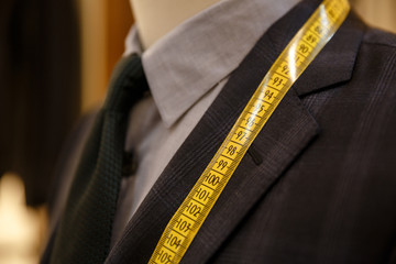 Close up shot of men suit jacket on hanger