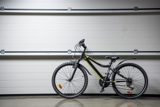 Mountain Bike Standing Indoors At Grey Wall