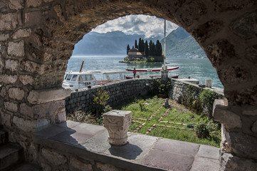 Island in the sea against the background of mountains
