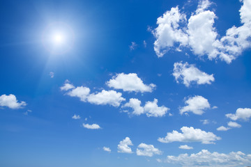 Naklejka na ściany i meble Blue sky with white cloud and sun.