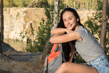 Beautiful fit and sporty active girl hiking near the canyon