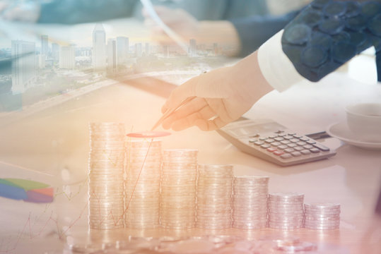 Double exposure of businessman with cityscape, coins and graph - Business concept, Immovable property and finance concept