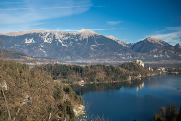 enjoying beautiful panoramic view on julian alps in winter by lake bled, slovenia