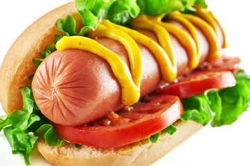 Hotdog with big sausage and fresh tomato isolated on white