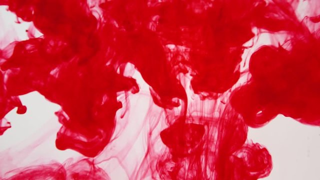 ink poured into water slow motion