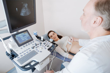 Attentive prominent specialist disclosing a diagnosis