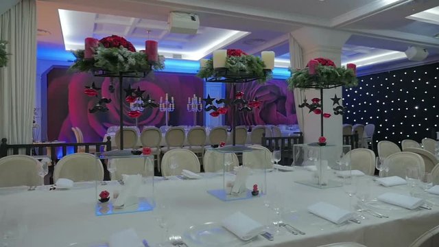 Banquet hall waiting for guests, Large empthy banquet hall. Ready for the holiday banquet hall. Steadicam shot.