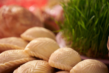 Novruz tray with Azerbaijan national desserts against silk scarf background