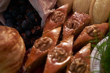 Novruz tray with Azerbaijan national desserts against silk scarf background