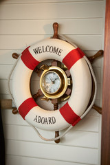 Wall clock in the form of a ship steering wheel