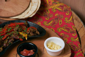 Mexican platillo Tacos of barbacoa and vegetarian with sauces and colorful table. mexican food tacos set.