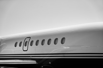 Airplane windows from the outside at the airport on a Parking for aircrafts.