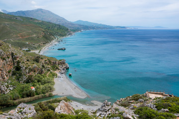 Fototapeta na wymiar Panorama of Preveli beach at Libyan sea, river and palm forest, southern Crete , Greece