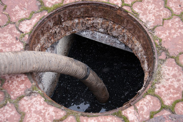 pumping sewage from the drain hole