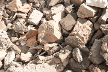Broken bricks on construction site as background