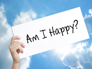 Am I Happy? Sign on white paper. Man Hand Holding Paper with text. Isolated on sky background