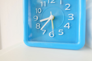 Blue clock in white