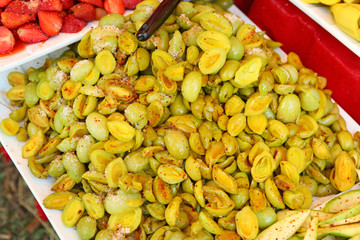 pickled fruits,Ma prang: Fermented Marian Plum,Preserved Marian plum, sprinkle with sugar, chili powder and salt