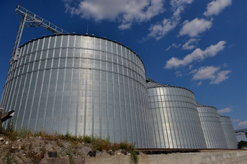 Fototapeta premium Agricultural Silo - Building Exterior, Storage and drying of grains, wheat, corn, soy, sunflower