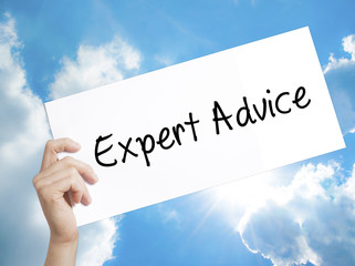 Expert Advice Sign on white paper. Man Hand Holding Paper with text. Isolated on sky background