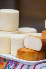 Pile of home made round cheese