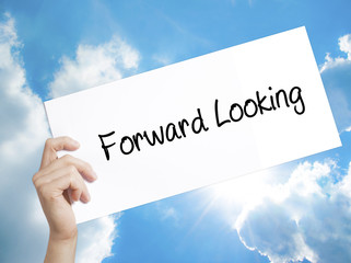 Forward Looking Sign on white paper. Man Hand Holding Paper with text. Isolated on sky background