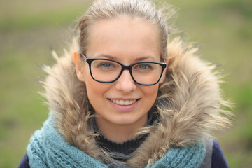 Beautiful girl with glasses in the wind