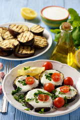 Grilled eggplants with yogurt dip and tomatoes.