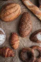 Pastries and bread with flour on table