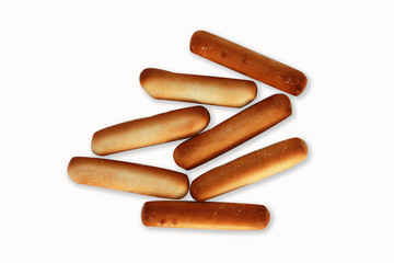 Bread sticks top view on white background.