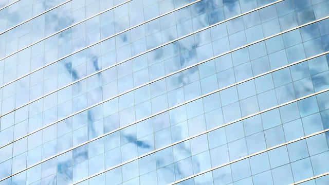 4K Time Lapse of Clouds Refelected in Modern Office Building