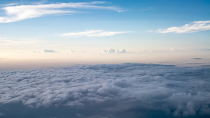 The beautiful cloudy and blue sky at early in the evening (view from airplane).