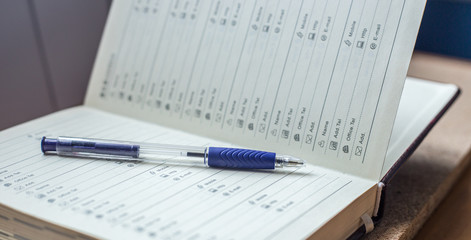 Adress book with a pen