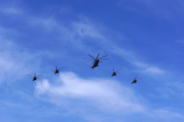 5 helicopters in the sky